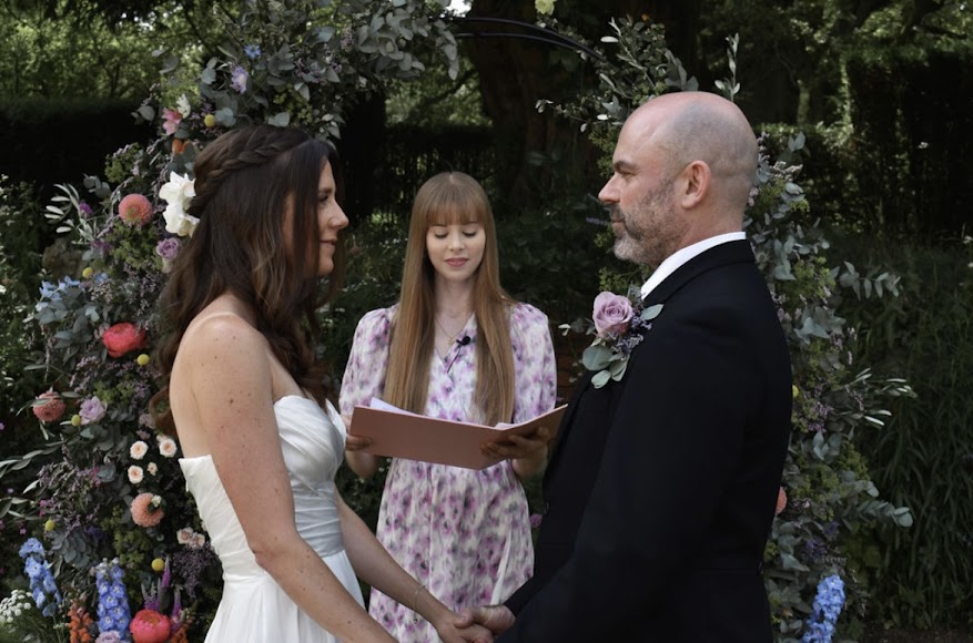 Wedding celebrant marries couple outside at Pamber Place Gardens Basingstoke in Hampshire
