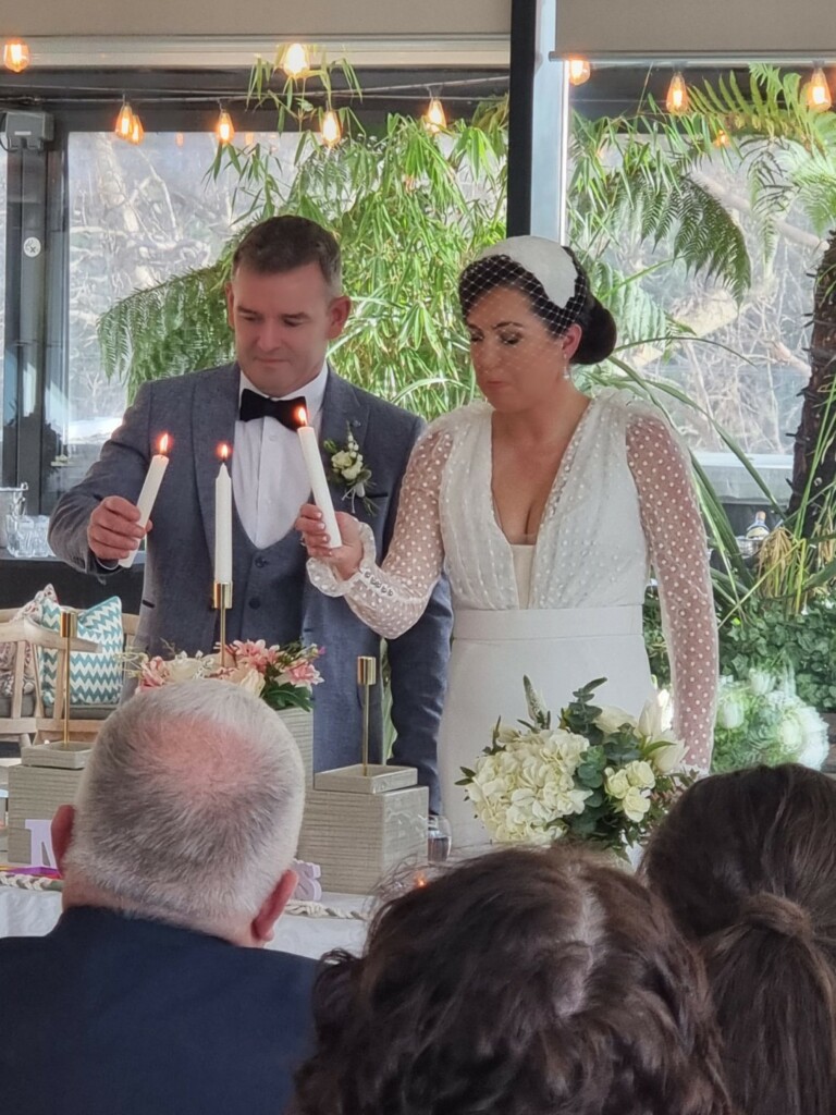 wedding couple having a Unity candle ceremony 